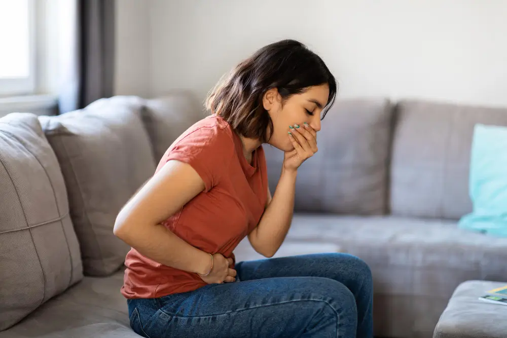 Women feeling Nausea and vomiting